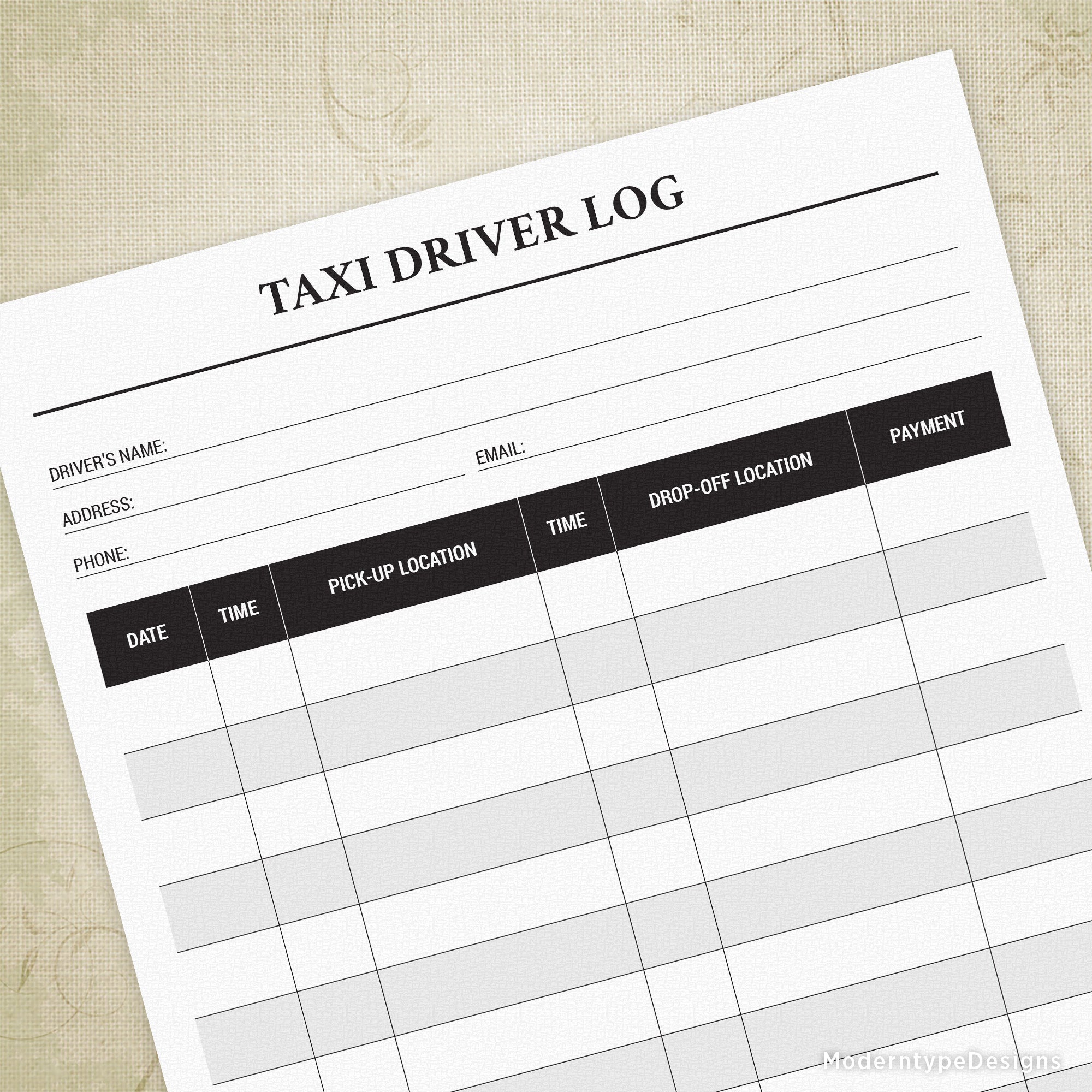 A printed Taxi Driver Log form displayed on a surface with fields for date, time, pickup location, and payment.