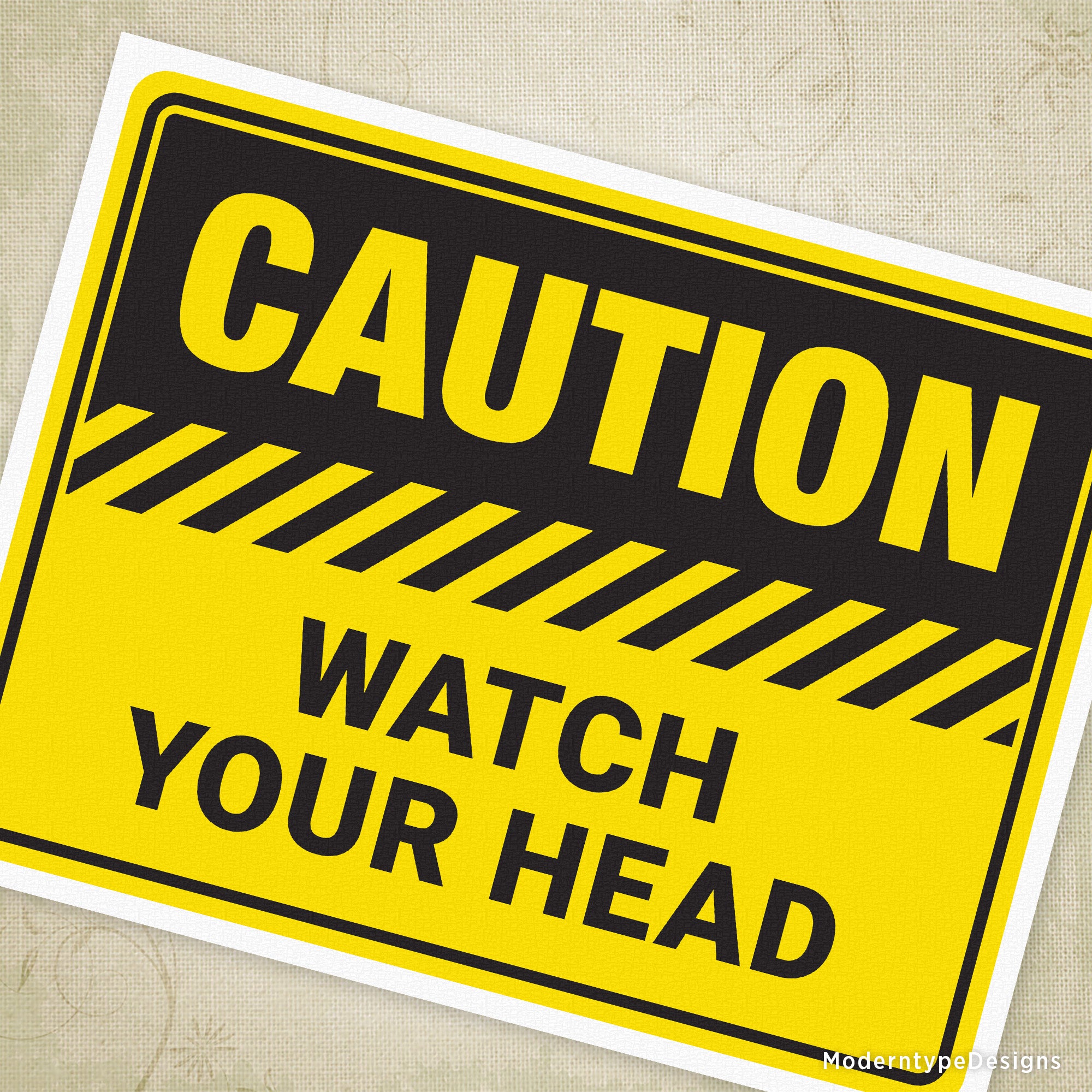 This Caution Watch Your Head Printable Sign PDF ensures safety by warning individuals about low clearance areas.