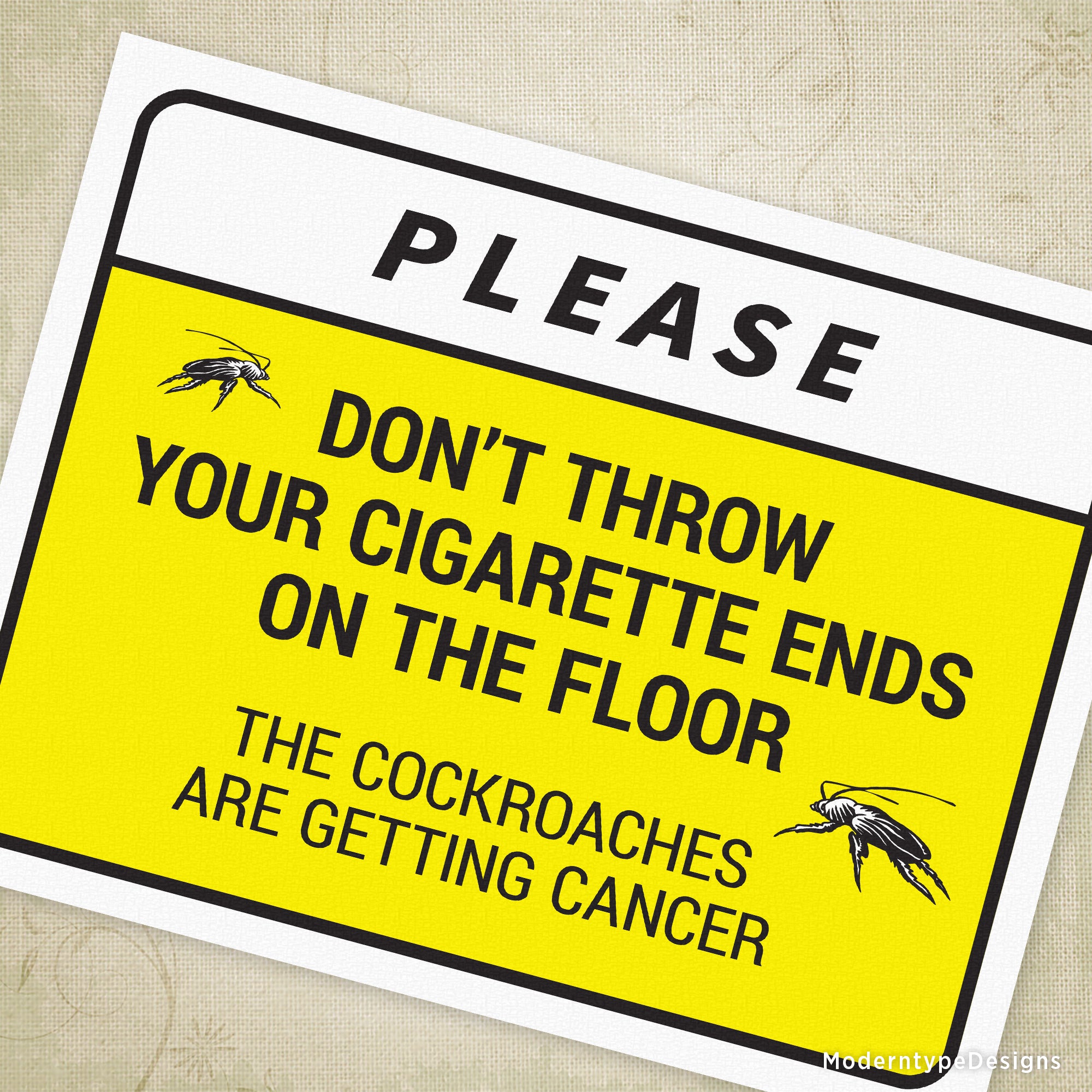A black and yellow sign with the text 'Please don't throw your cigarette ends on the floor THE COCKROACHES ARE GETTING CANCER' and a graphic of cockroaches.