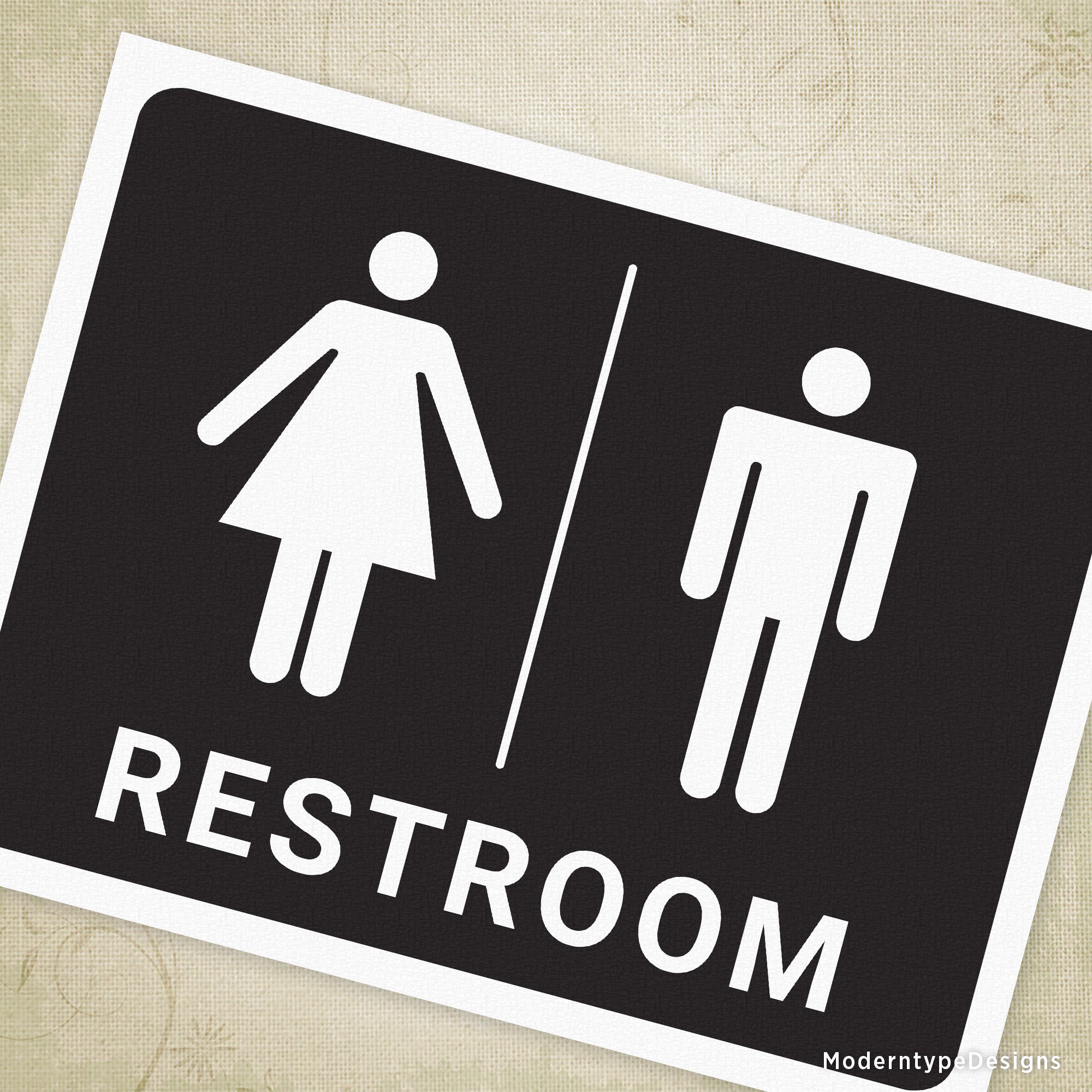 A printable sign showing a pictogram for a restroom indicating facilities for women and men, with a black background and white illustrations.