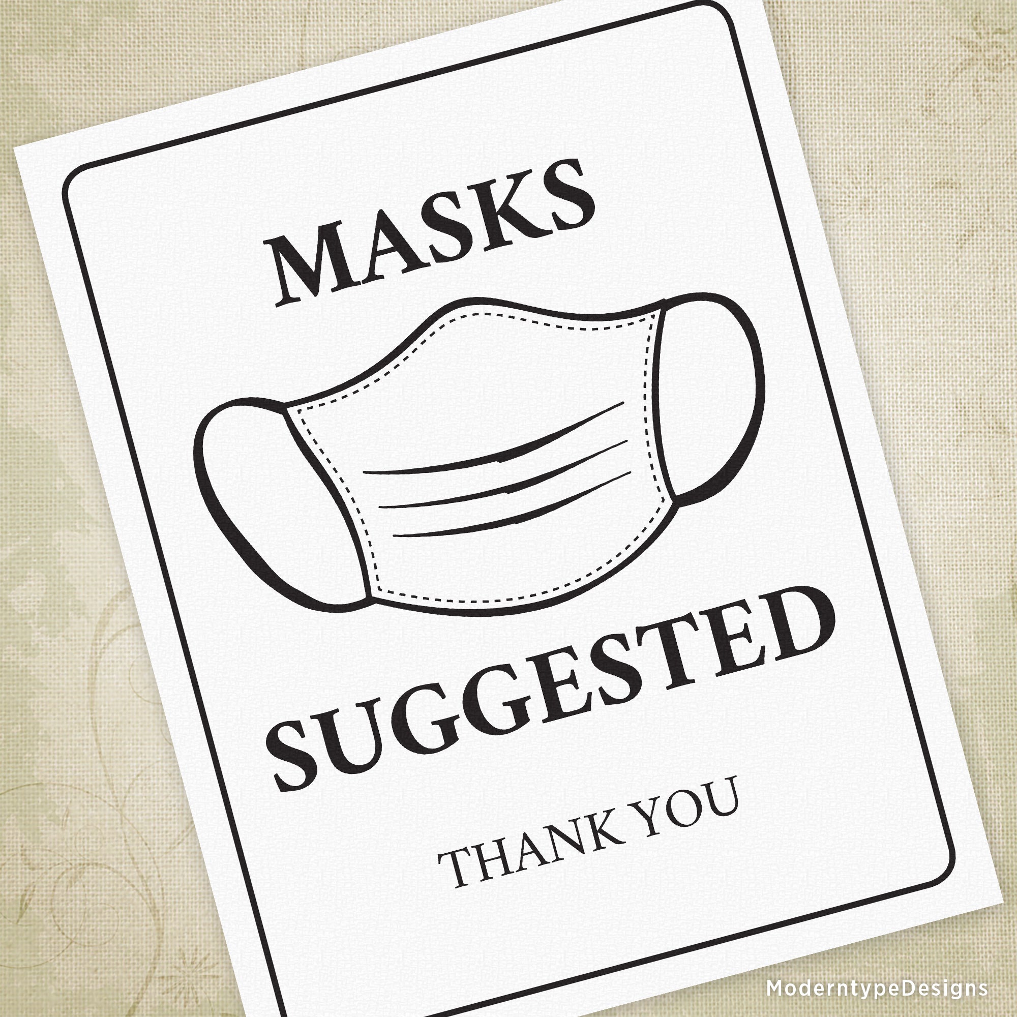 A printable sign with the text 'MASKS SUGGESTED' and a graphic of a face mask over a white background.